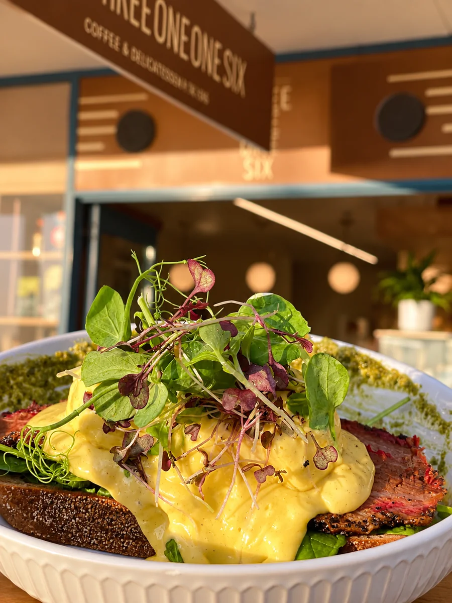 A brunch plate with greens at Three One One Six